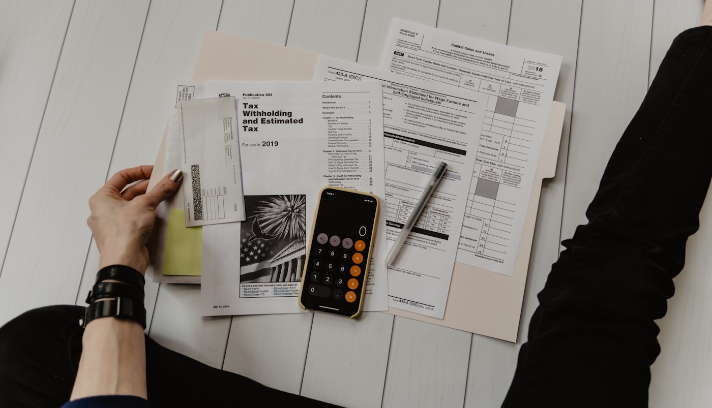 Calculator, documents and financial planning notes